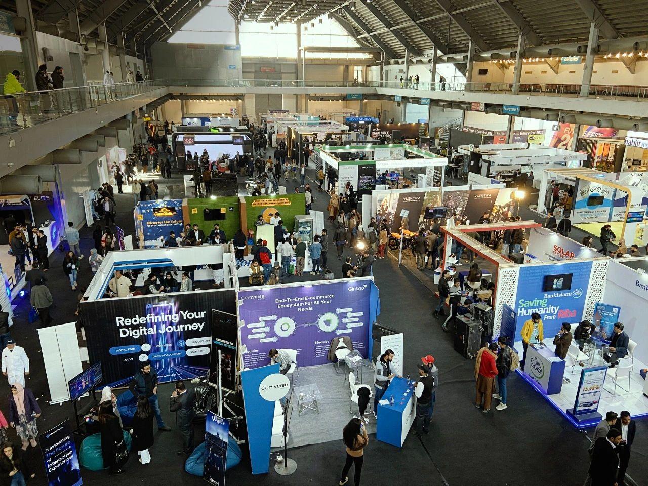 Engineer Adil Amin Future Fest exhibition hall with technology booths and attendees